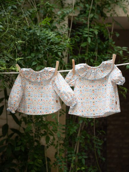 BLUSA VOLANTE BEBÉ M/LARGA-MANDARINA